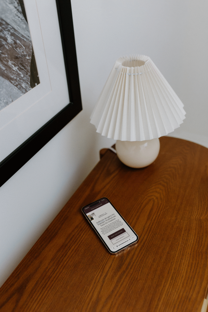 iPhone showcasing photography website examples, featuring a modern photography layout. 