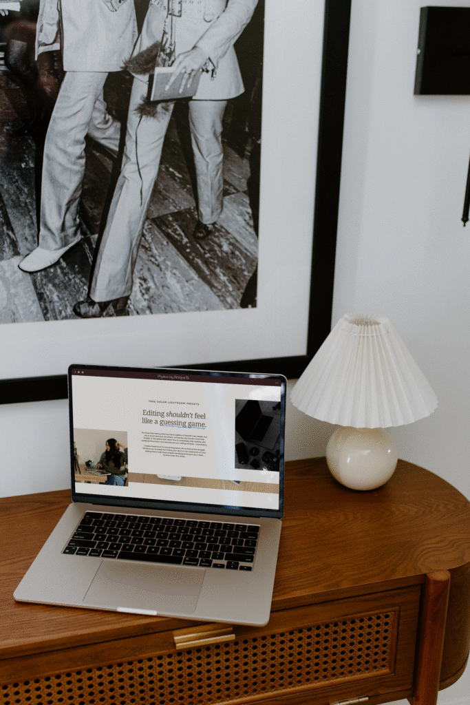 Laptop showcasing a photography website design with a modern photographer homepage. 