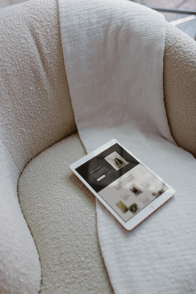 Ipad on chair showing example of professional photography website with a minimalist photographer layout. 